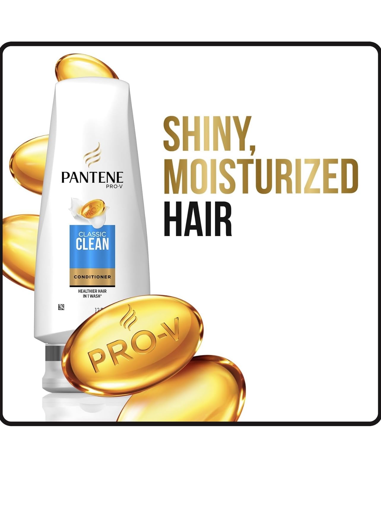Applying Pantene Classic Clean conditioner to hair for smoothness.