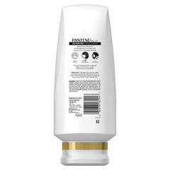 Label closeup shows Frizz Calming Complex for smoother cuticles.