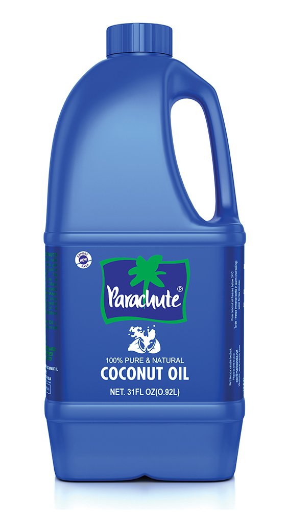 Parachute coconut oil bottle pour showing versatile kitchen and skin care use