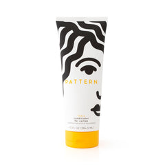 PATTERN Heavy Conditioner bottle pour demonstrates easy detangling and hydration for curls.
