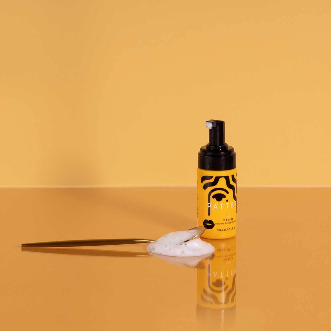 PATTERN Mini curl mousse foam shows airy texture for defined wash-and-go.