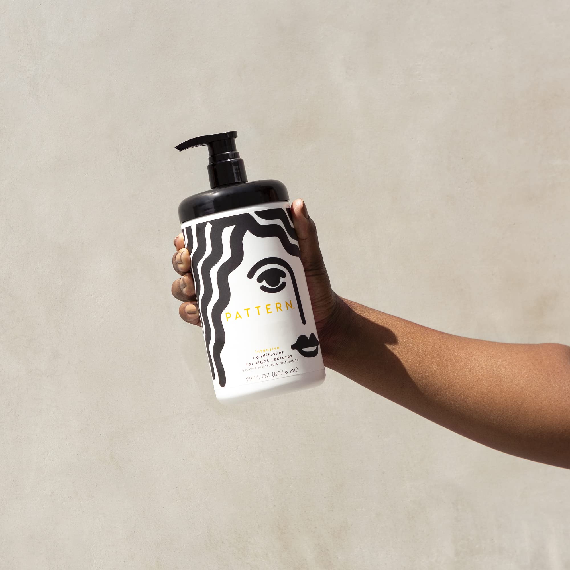 PATTERN Intensive Conditioner applied to hair to soften and hydrate.