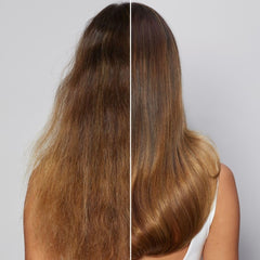 Bond Rx Reparative Oil being applied to mid-lengths for frizz control
