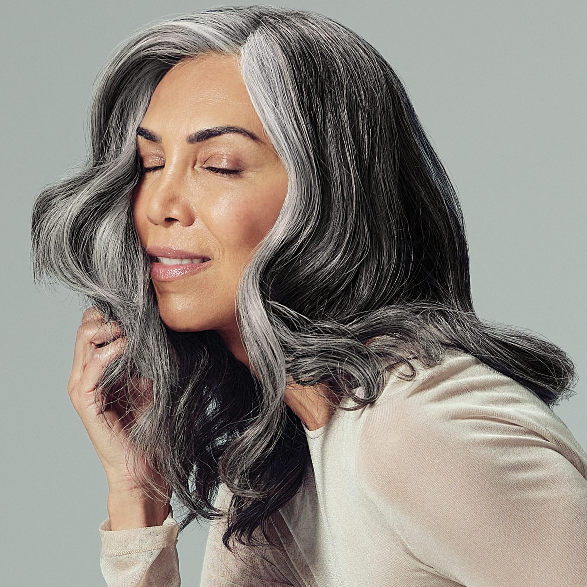 Paul Mitchell Extra-Body Gel on brushed-out style, flexible, touchable hold.