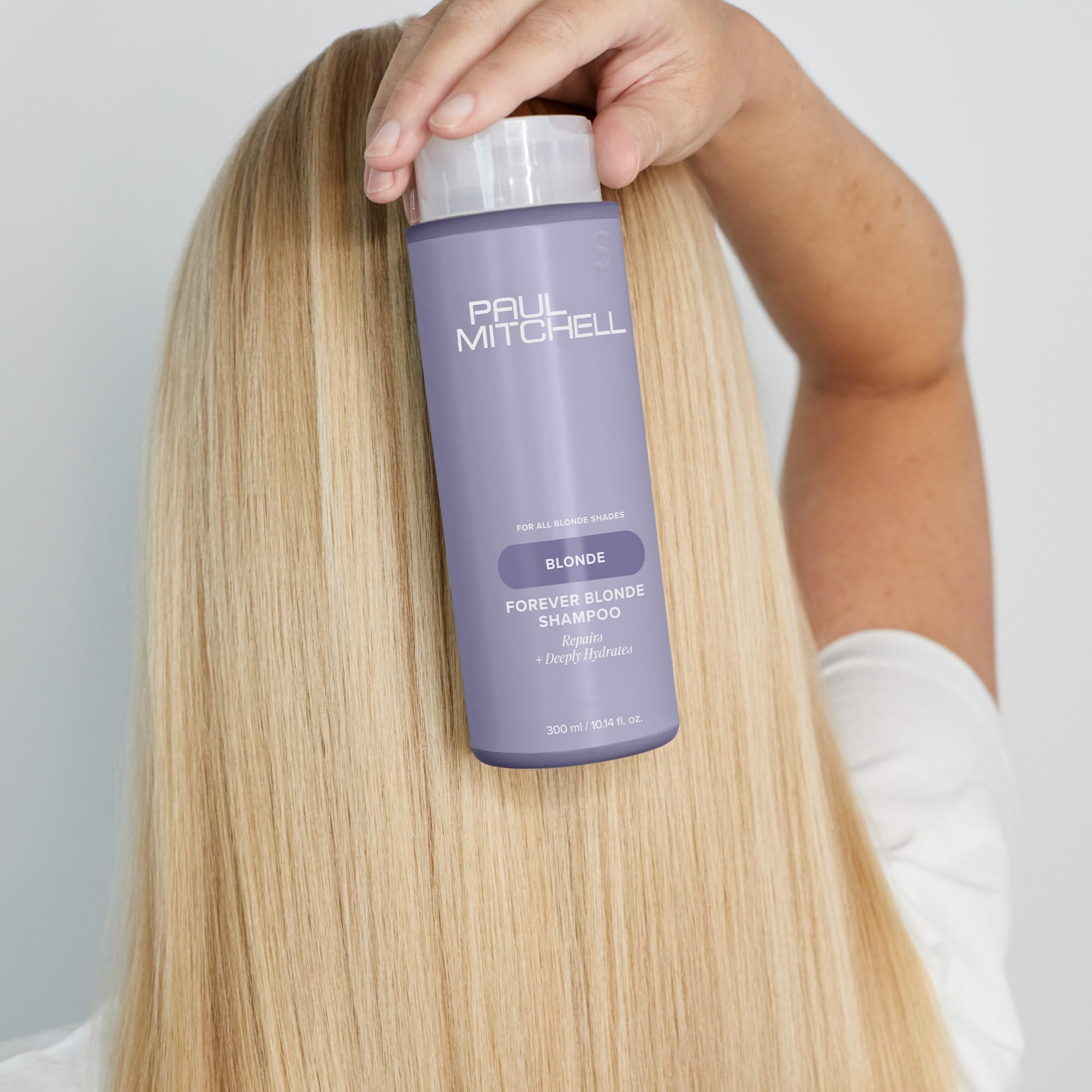 Paul Mitchell Forever Blonde Shampoo on shelf highlighting sustainable PCR packaging