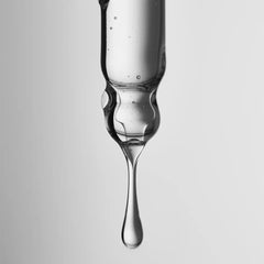 Close-up of scalp area showing soothing formula helping balance sebum over time.