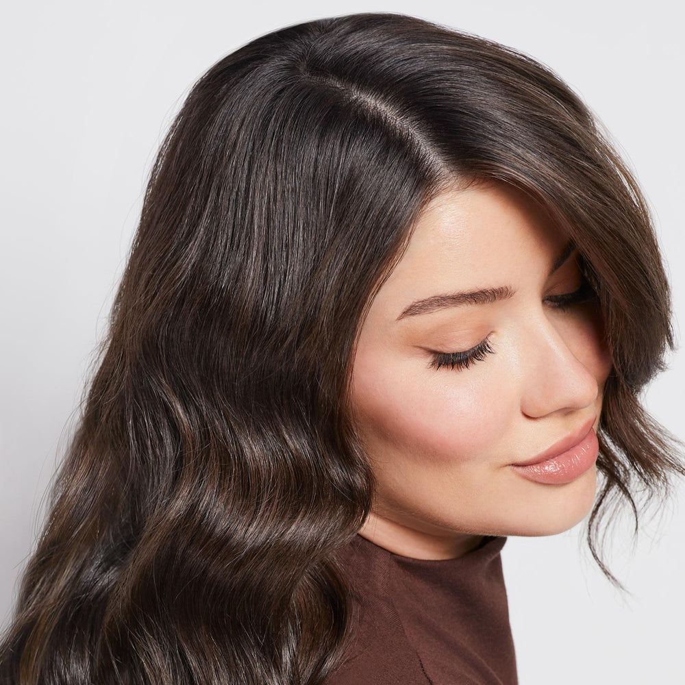 Paul Mitchell Scalp Therapy Drops droplet applying on damp hair for targeted care.