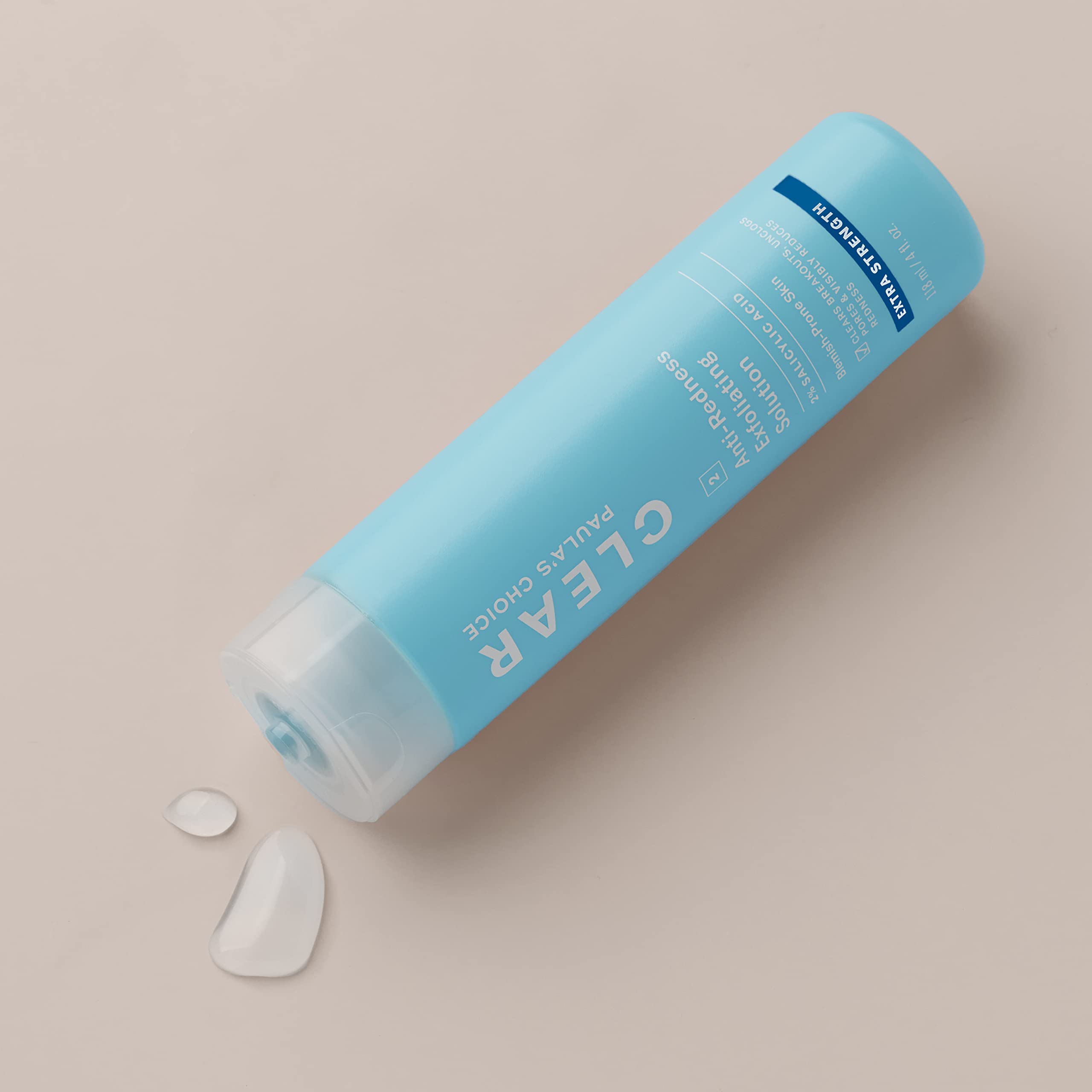 Liquid texture visible in bottle suggesting gentle, leave-on exfoliation for daily use