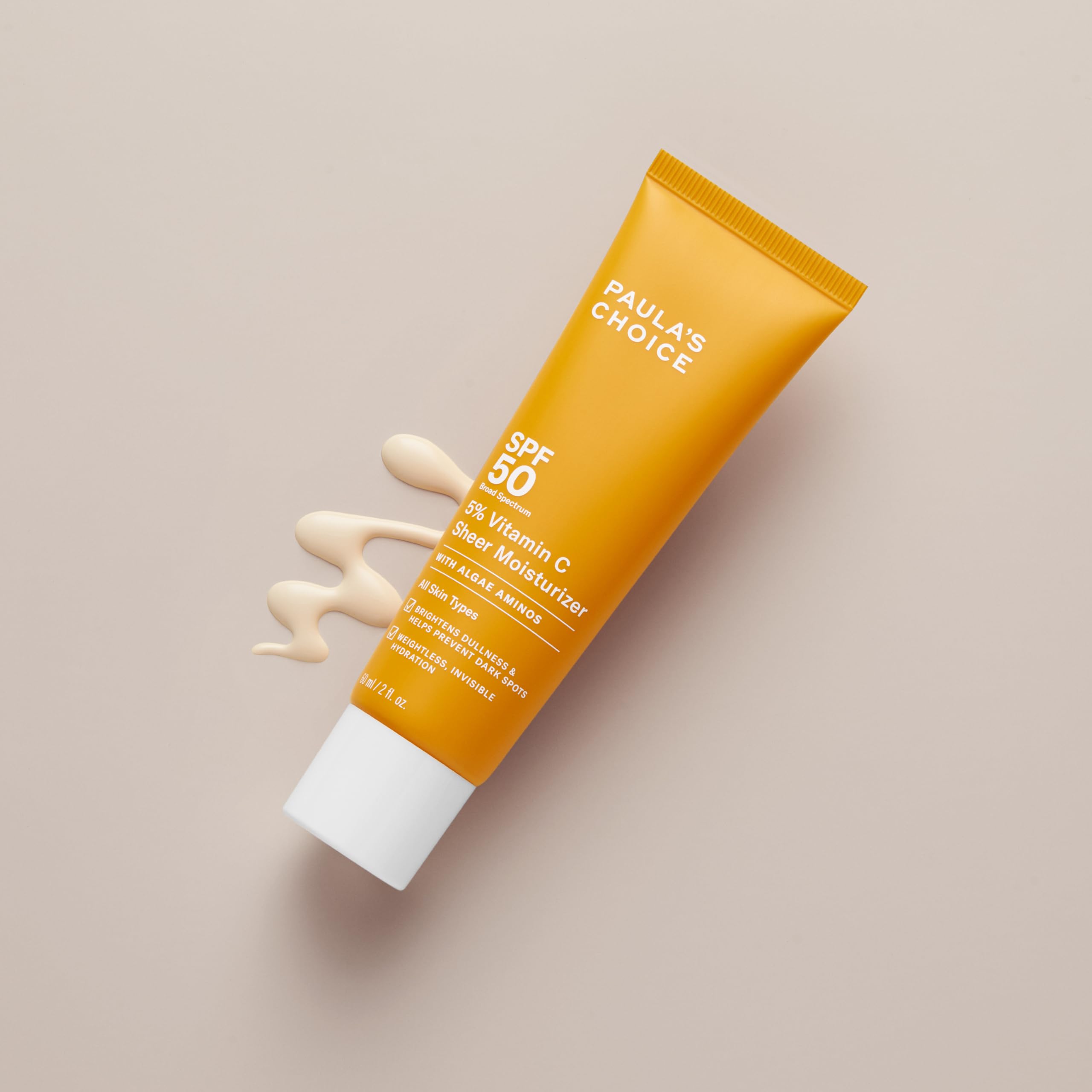 Paula's Choice sunscreen texture on skin during application highlights smooth glide.