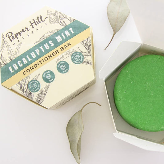 Close-up of Pepper Hill shampoo bar in eucalyptus mint, ideal for eco-friendly on-the-go use.