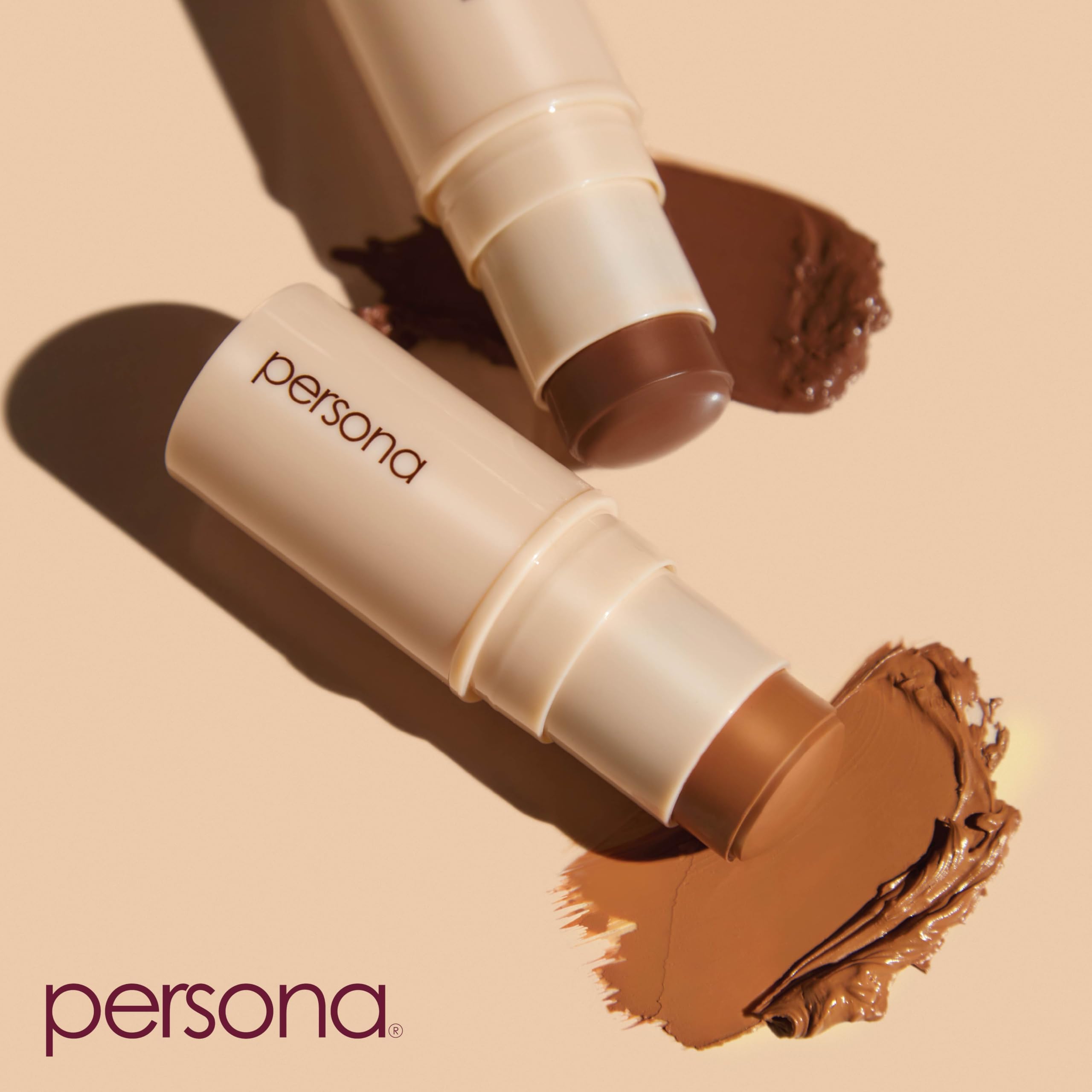 Close-up swatch of Persona Dreamstick Cream Bronzer showing smooth texture