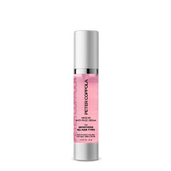 Peter Coppola Infusion Anti-Frizz Cream bottle pour for effortless smoothness and frizz control.