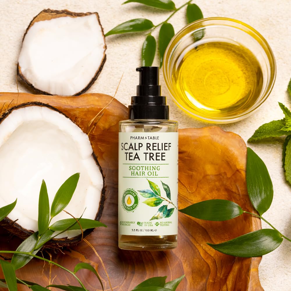 PHARM TO TABLE Tea Tree Hair Oil applied to scalp for hydration.