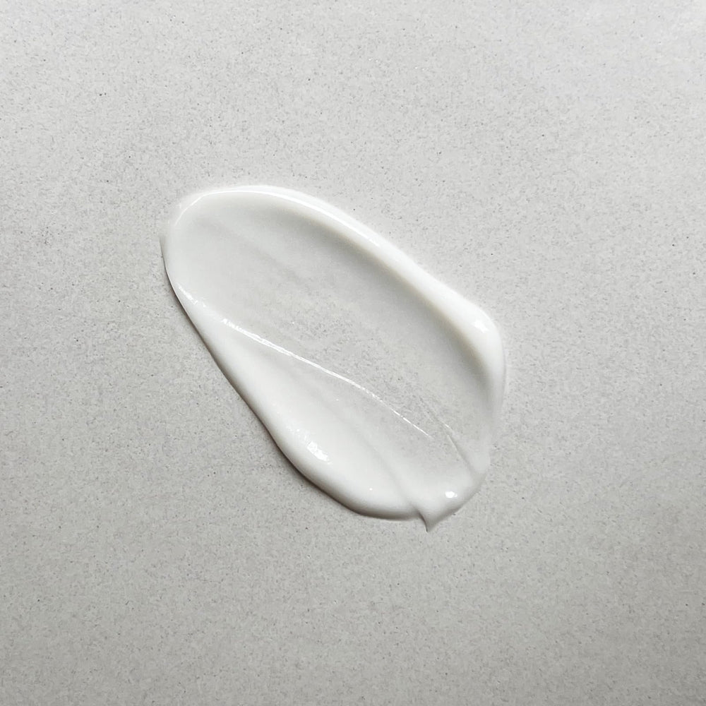 Pharmacopia Hotel Verbena lotion texture close-up with creamy, nourishing feel.