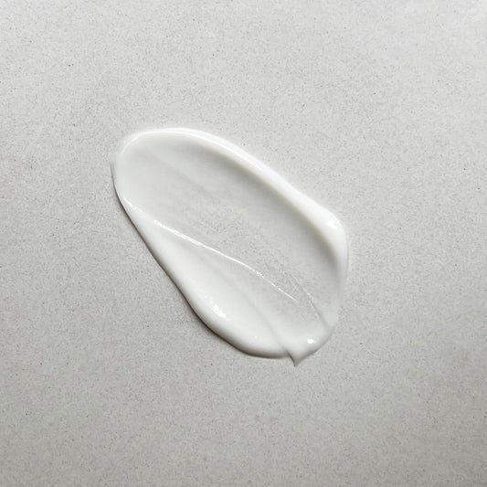 Pharmacopia Hotel Verbena lotion texture close-up with creamy, nourishing feel.
