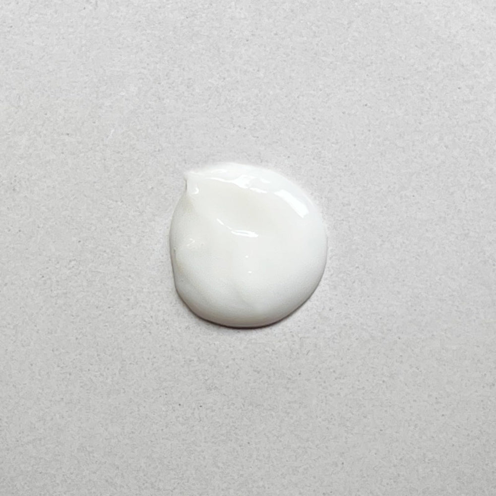 Pharmacopia Verbena Conditioner bottle close-up with creamy texture and botanicals.