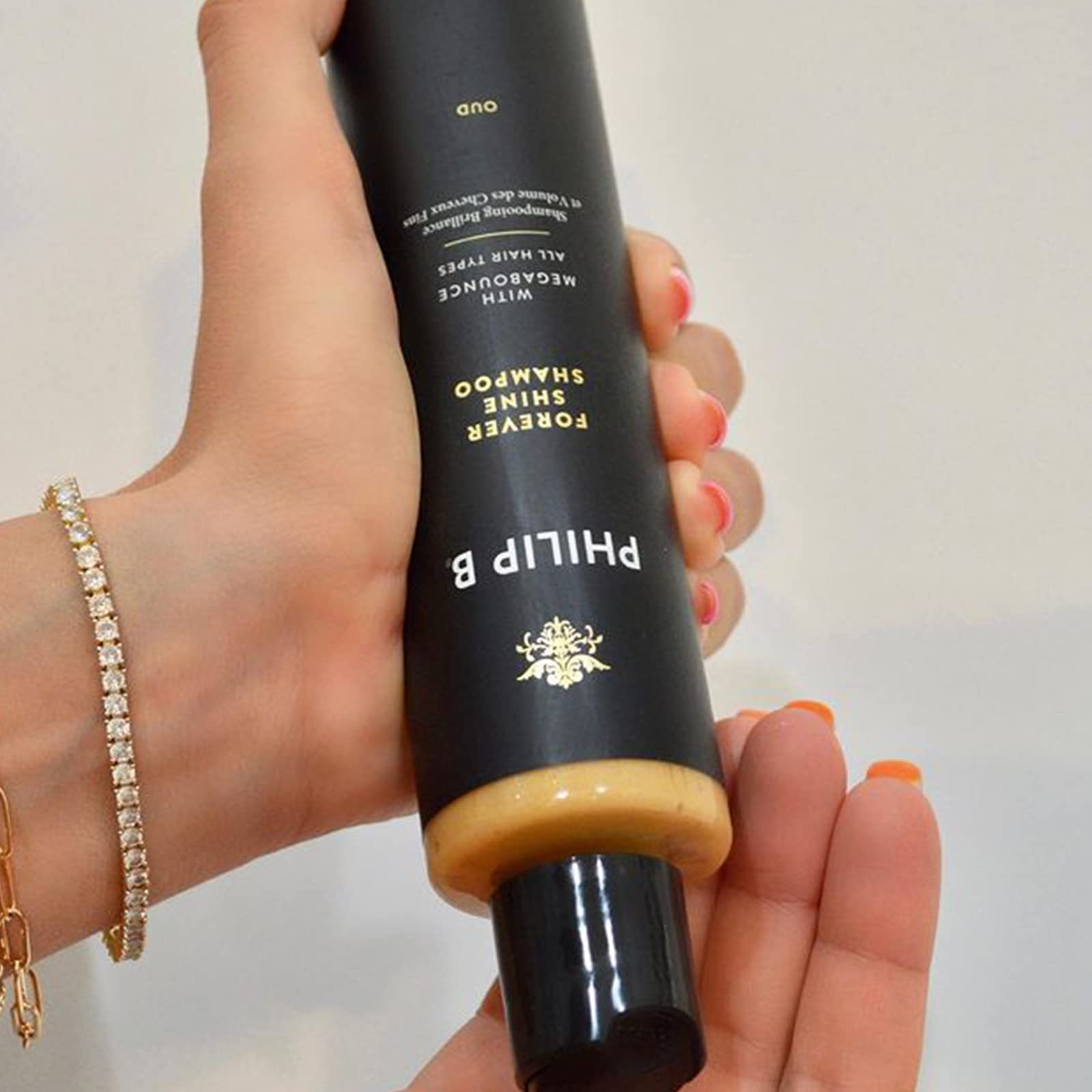 PHILIP B Forever Shine Shampoo bottle-pour demonstrating easy application
