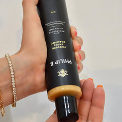 PHILIP B Forever Shine Shampoo bottle-pour demonstrating easy application