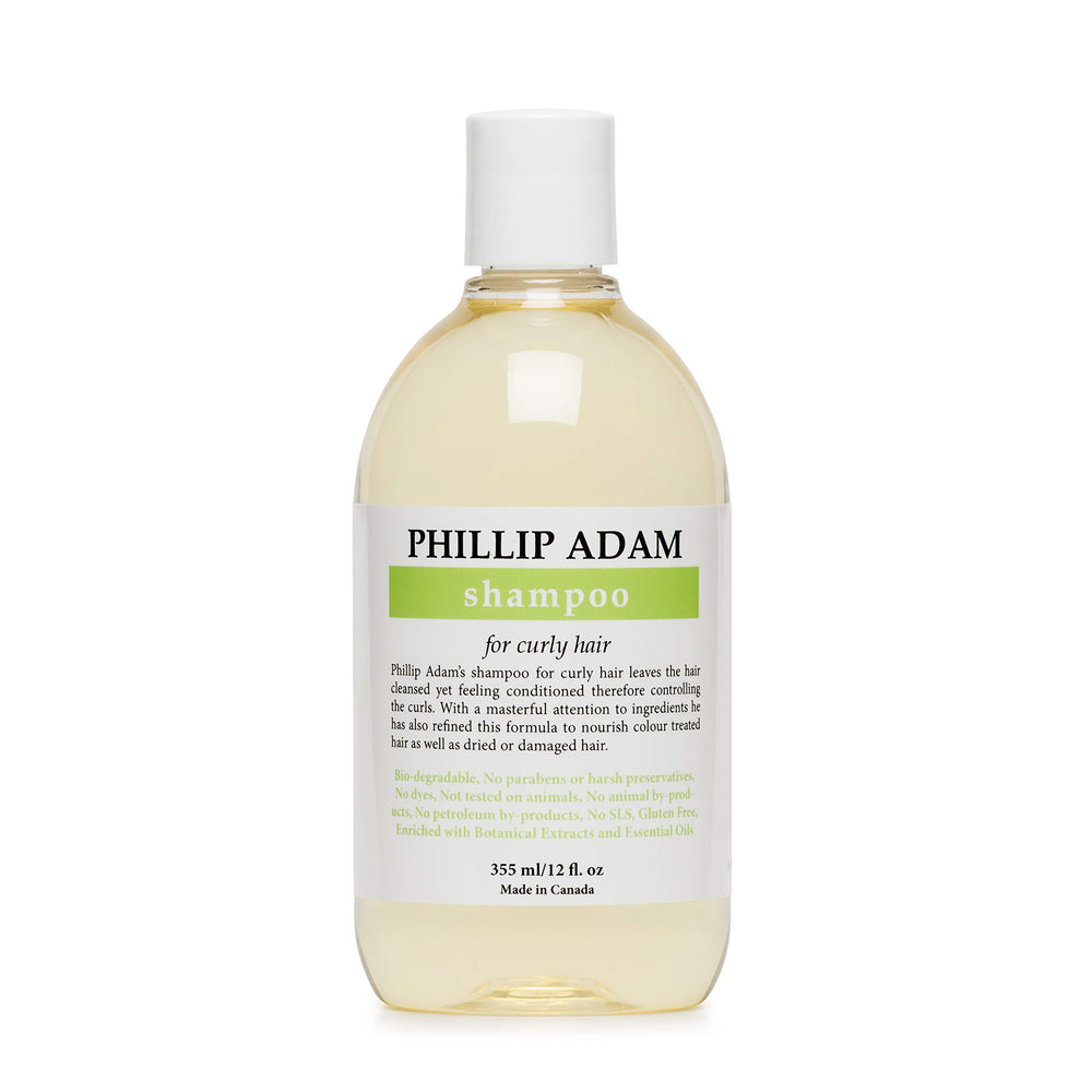 Phillip Adam Curly Shampoo bottle pouring hydration for curls