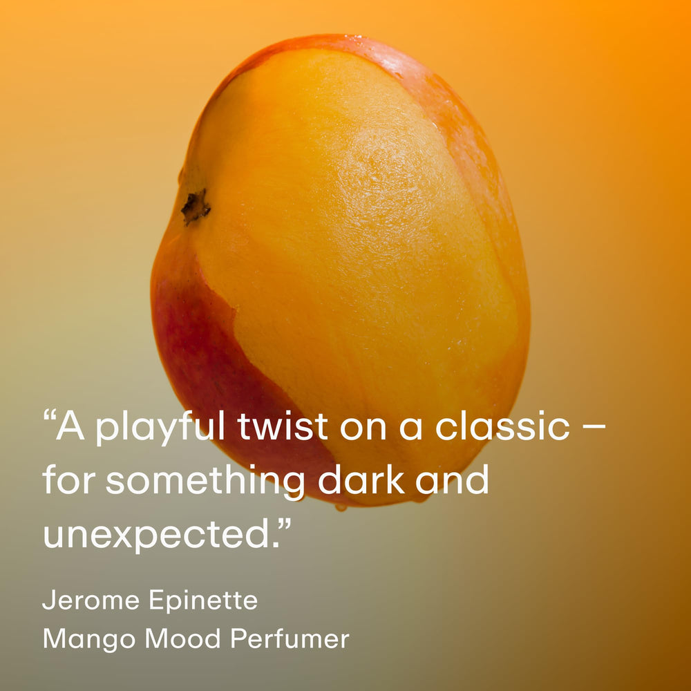 PHLUR Mango Mood hair and body mist in hand, ready for light fragrance layering.