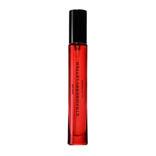 PHLUR Strawberry Letter bottle with magnetic lid, showcasing chic packaging and reduced plastics.