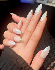 PHYLIN LEAF nails on hand showcasing elegant beach-inspired style.
