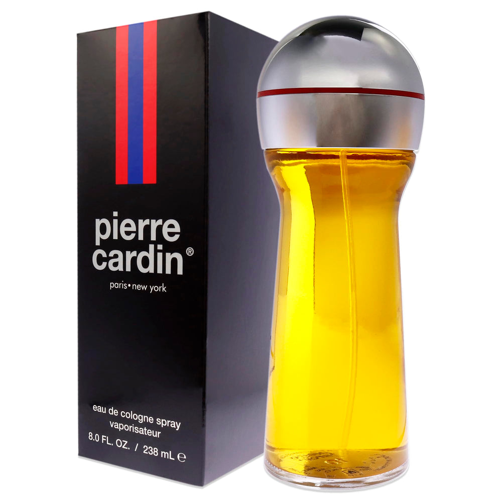 Pierre Cardin applying perfume to skin for lingering aroma.