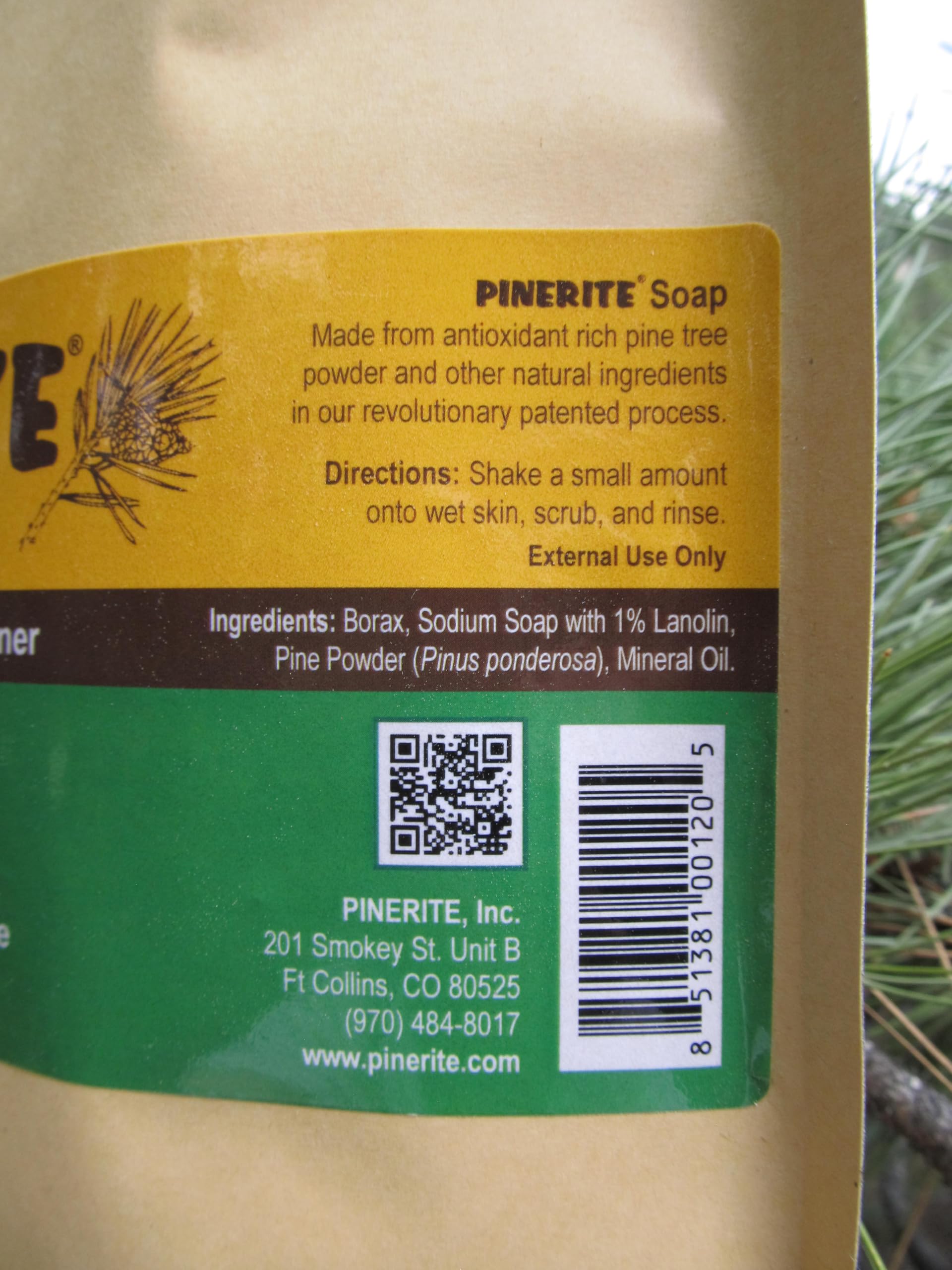 Pinerite powdered hand soap in workshop scene for heavy-duty mess cleanup.