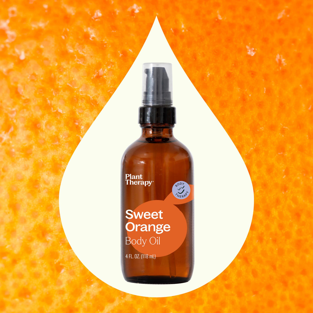 Golden drops of Plant Therapy Sweet Orange Body Oil suggest nourishing hydration.