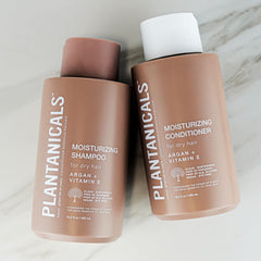 Plantanicals Moisturizing Shampoo luxuriously foams with vitamin E, enhancing shine.