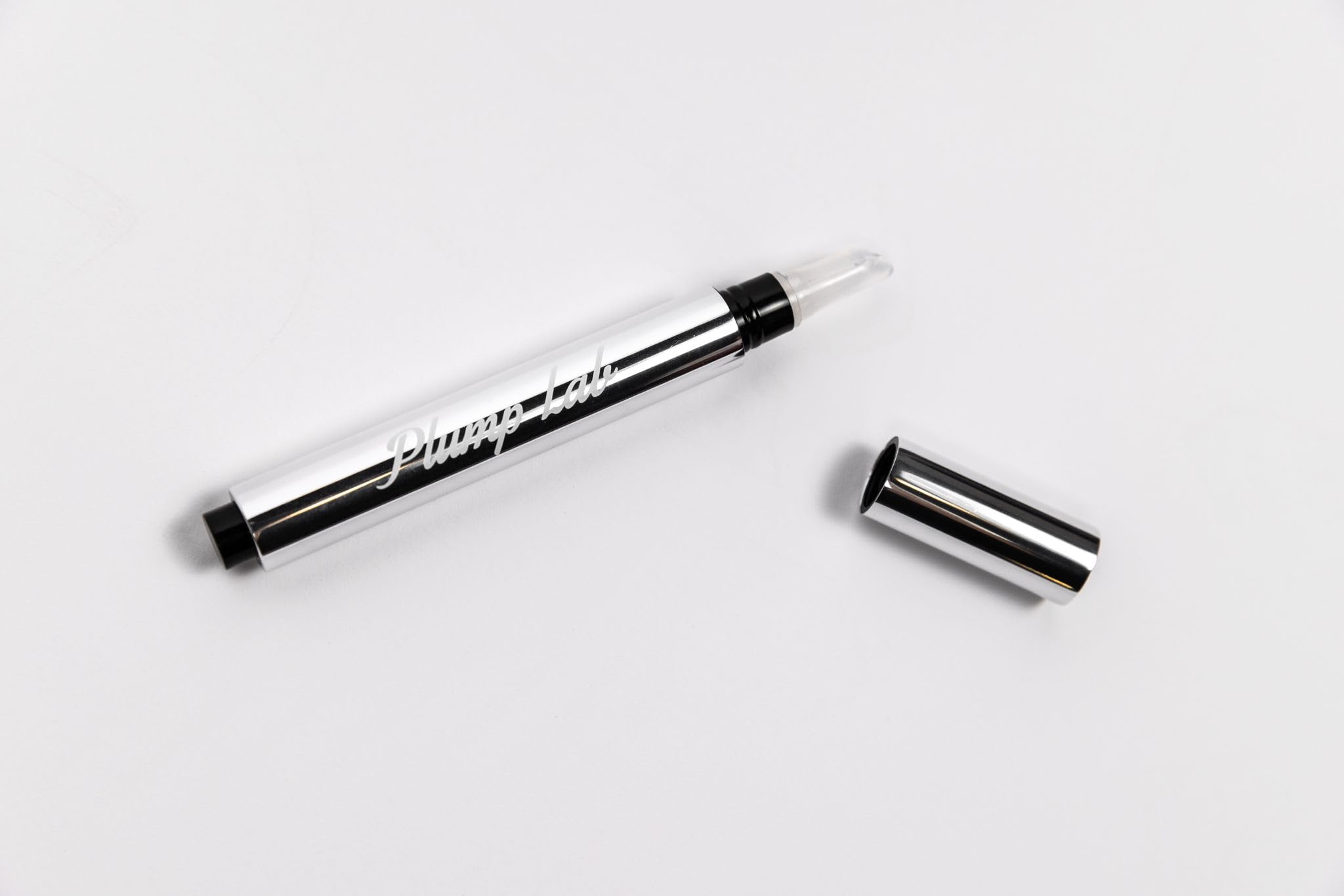 Plump Lab lip plumper gloss hydration glow on lips.