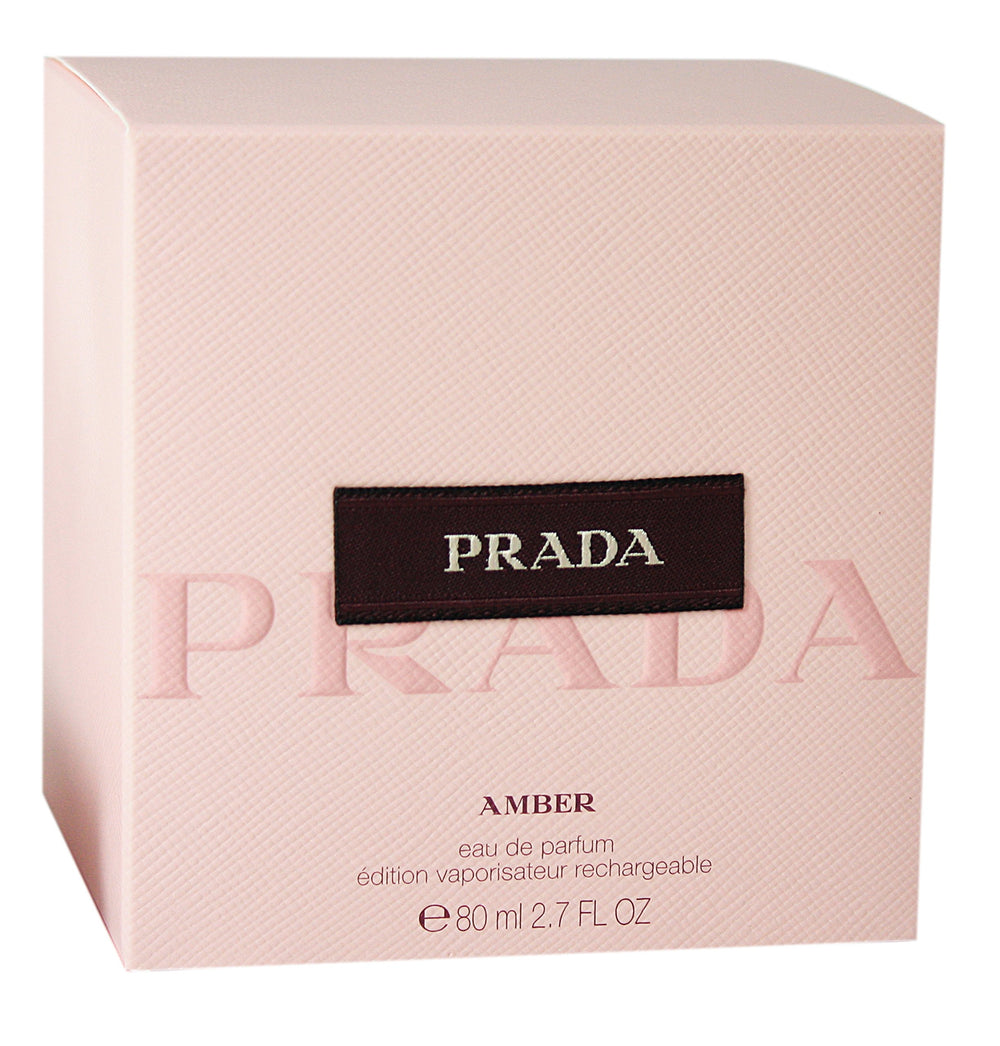 Prada Amber by Prada spray bottle emphasizes warm amber notes for evening wear.