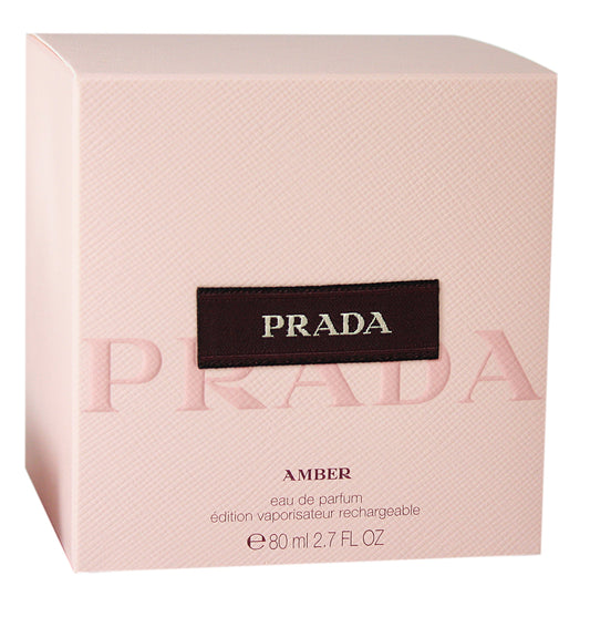 Prada Amber by Prada spray bottle emphasizes warm amber notes for evening wear.