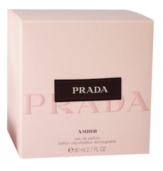 Prada Amber by Prada spray bottle emphasizes warm amber notes for evening wear.