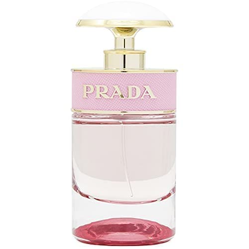 Prada Candy Florale bottle reflection under soft lighting.