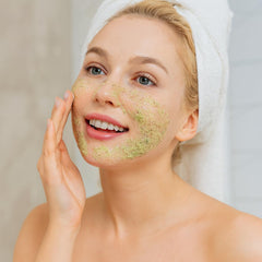 Precision Beauty Green Tea Exfoliating Scrub texture close-up with gentle beads for radiant skin.
