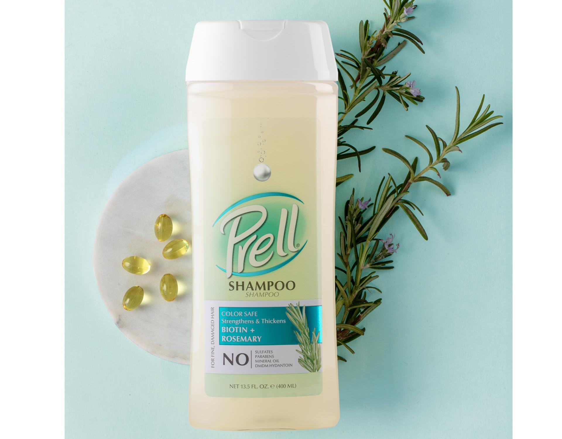 Prell Biotin + Rosemary shampoo packaging on shelf signals color-safe care for families