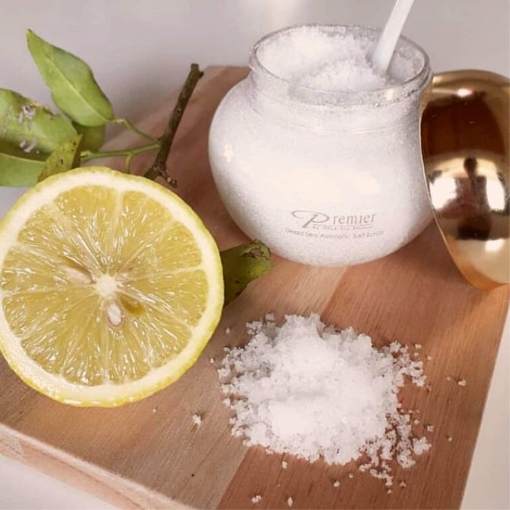 Premier Dead Sea Aromatic Salt Scrub texture closeup reveals mineral grains for gentle exfoliation.