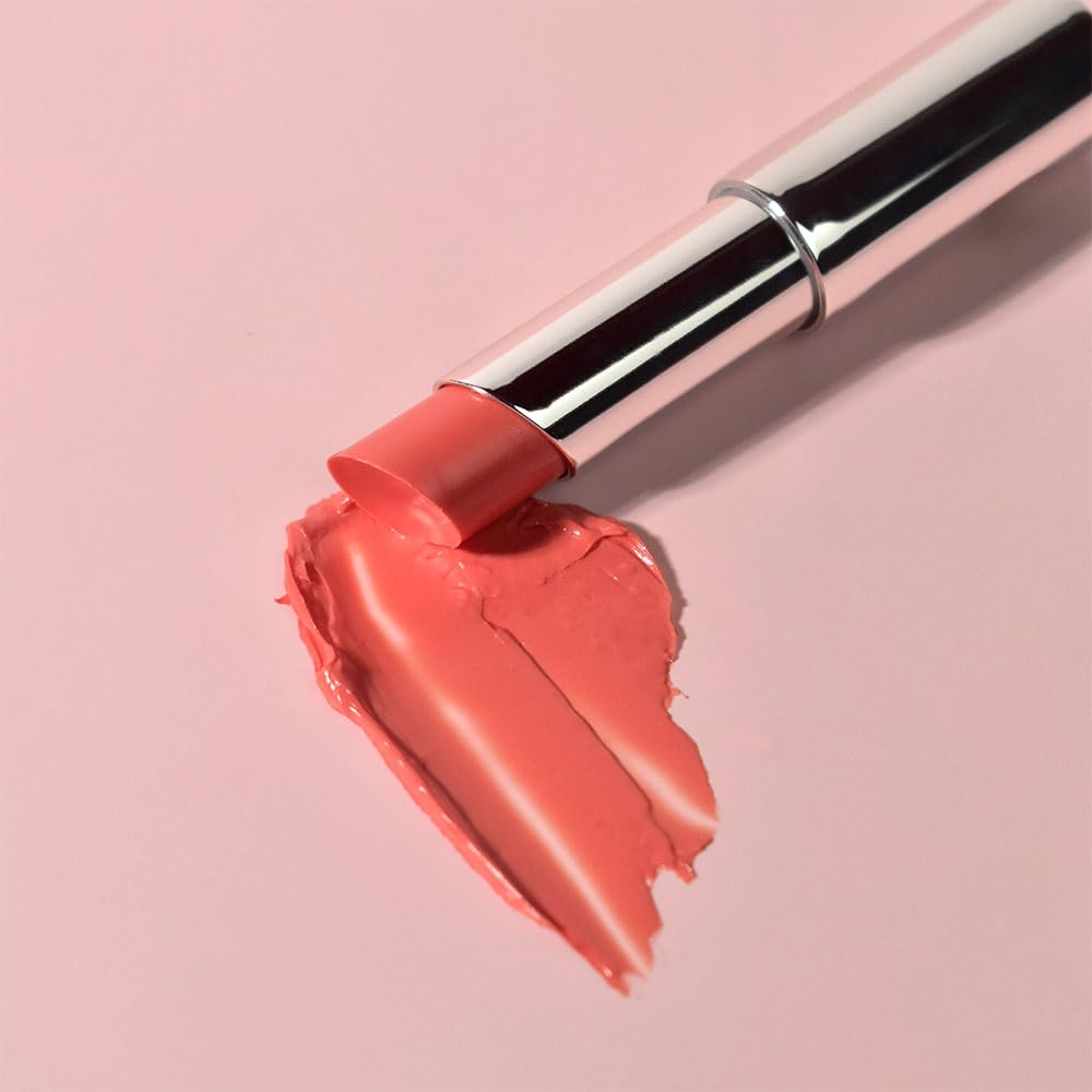 PRETTYSKIN lip balm Aura Coral swatch adds peach warmth for brightness.