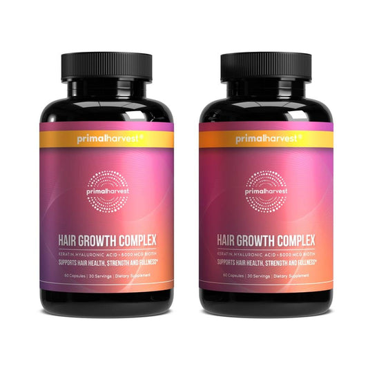 Primal Harvest Hair Growth Vitamins bottle close-up for daily hair support.