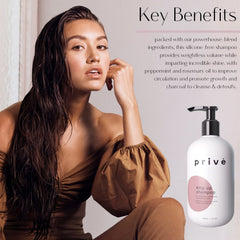 Pouring Privé Amp Up shampoo into hand for application