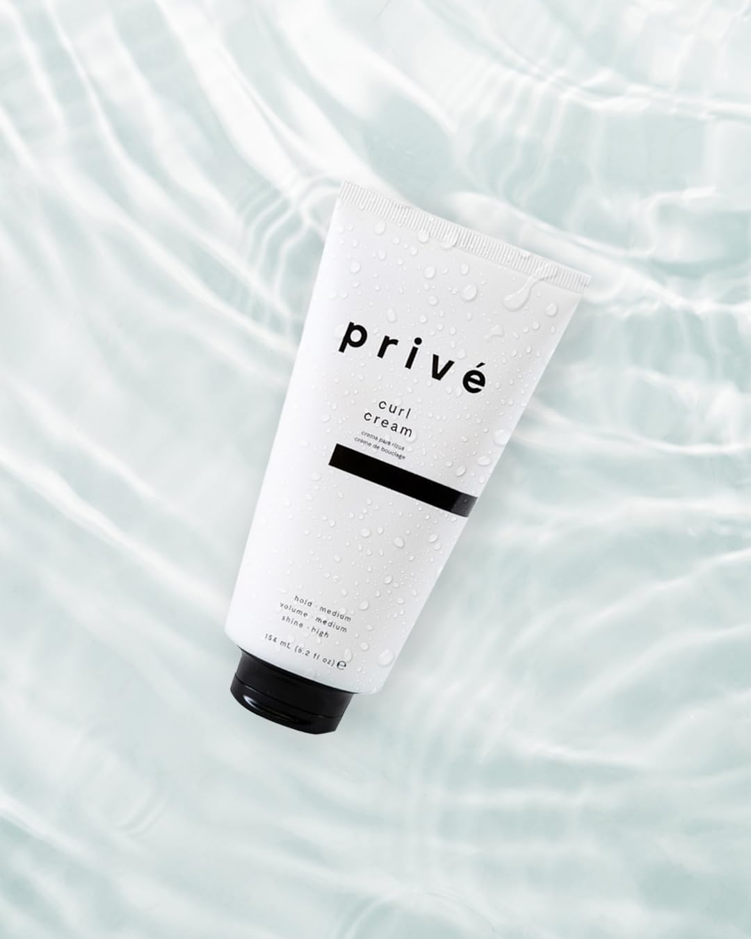Prive curl cream being applied to hair for definition