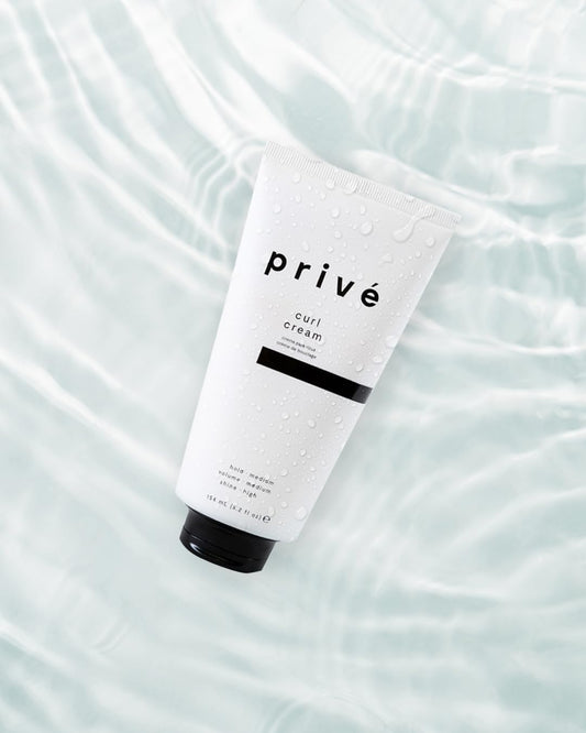 Prive curl cream being applied to hair for definition