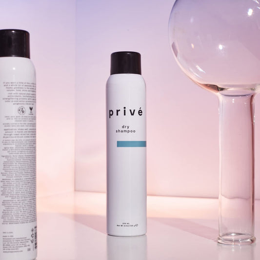 Close-up of spray nozzle delivering volumizing mist for instant texture.