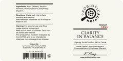 Hands applying Probiotic Action Clarity in Balance spray to face