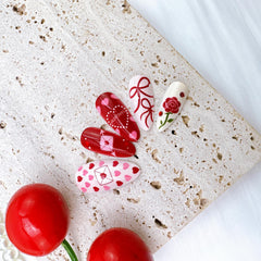 PSBRBAD nails with heart rhinestones add sparkle for celebrations and dates.