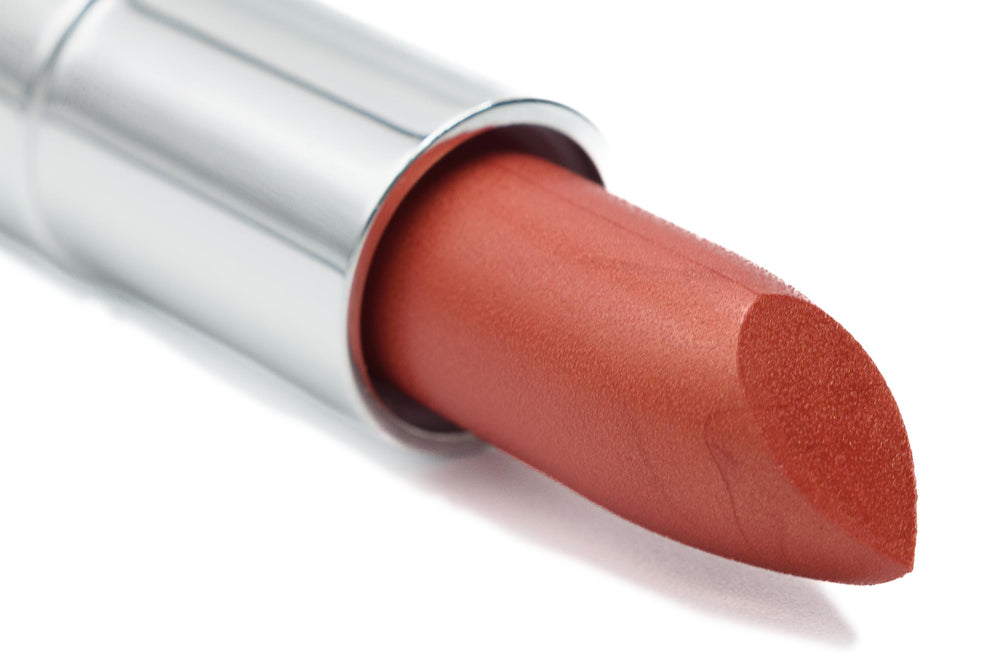 Pure Ziva Orange Sunset lipstick tube with shimmering red-orange finish.
