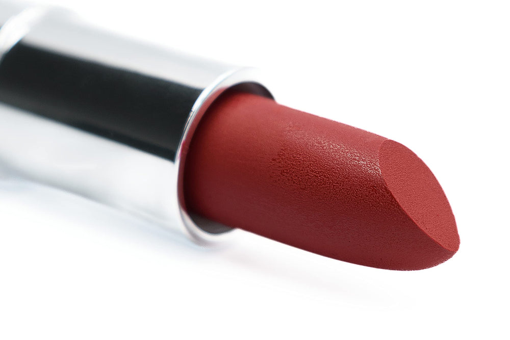 Pure Ziva Red Audacity lipstick cap closeup shows bold color and premium packaging.