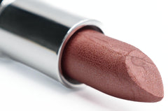 Pure Ziva Spicy Rum Nude Burgundy lipstick tube shows creamy color and subtle shimmer.