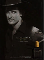 Man applying PureScents Stetson Black aftershave, emphasizing masculine woody scent